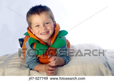 3 year old boy looking into camera lying on his tummy View Large Photo Image Stock Photo - 3 year old boy looking into camera lying on his tummy. Fotosearch
