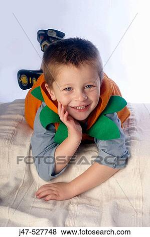 3 year old boy lying on his tummy, smiling into camera View Large Photo Image Stock Photo - 3 year old boy lying on his tummy, smiling into camera. Fotosearch
