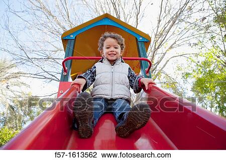 3 year old boy playing in a playground View Large Photo Image Stock Image - 3 year old boy playing in a playground. Fotosearch