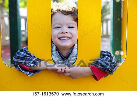 3 year old boy playing in a playground View Large Photo Image Stock Image - 3 year old boy playing in a playground. Fotosearch