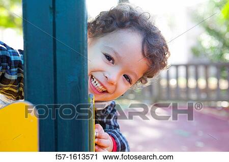 3 year old boy playing in a playground View Large Photo Image Stock Image - 3 year old boy playing in a playground. Fotosearch