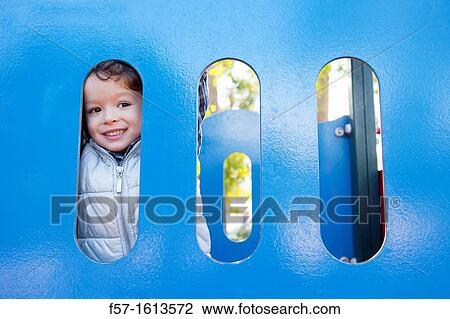 3 year old boy playing in a playground View Large Photo Image Stock Image - 3 year old boy playing in a playground. Fotosearch