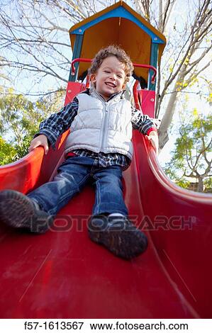 3 year old boy playing in a playground View Large Photo Image Stock Photo - 3 year old boy playing in a playground. Fotosearch