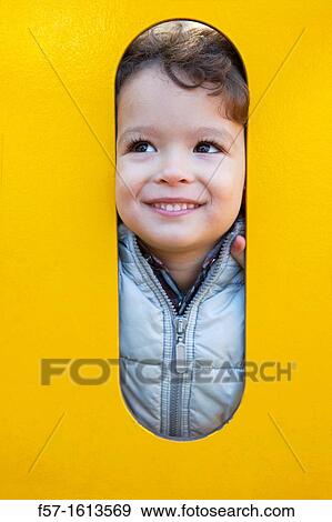 3 year old boy playing in a playground View Large Photo Image Stock Photo - 3 year old boy playing in a playground. Fotosearch