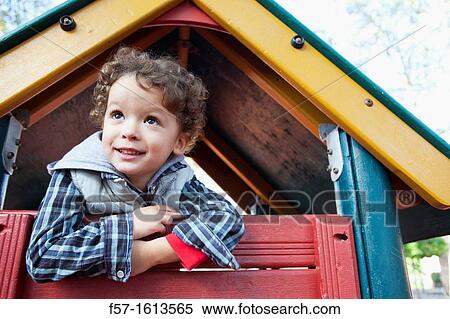 3 year old boy playing in a playground View Large Photo Image Stock Photography - 3 year old boy playing in a playground. Fotosearch