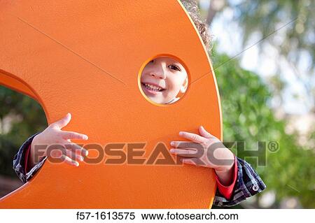 3 year old boy playing in a playground View Large Photo Image Stock Photography - 3 year old boy playing in a playground. Fotosearch