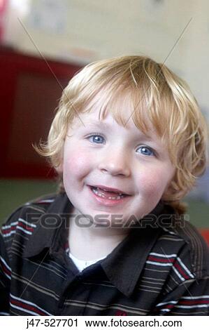 3 year old boy smiling into camera at nursery View Large Photo Image Stock Image - 3 year old boy smiling into camera at nursery. Fotosearch