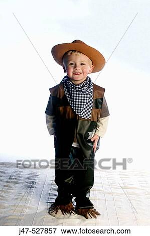 3 year old boy smiling into camera wearing a cowboys outfit View Large Photo Image Stock Photo - 3 year old boy smiling into camera wearing a cowboys outfit. Fotosearch