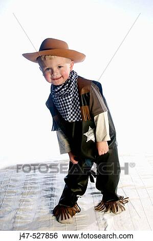 3 year old boy smiling into camera wearing a cowboys outfit View Large Photo Image Stock Photograph - 3 year old boy smiling into camera wearing a cowboys outfit. Fotosearch