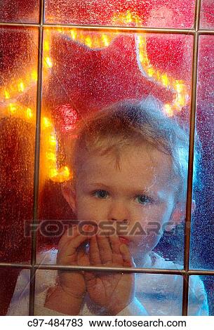 3 year old boy waiting on Christmas behind frozy window. View Large Photo Image Stock Image - 3 year old boy waiting on Christmas behind frozy window.. Fotosearch