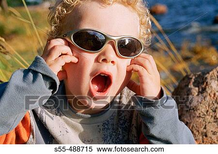 3 year old boy with sunglasses View Large Photo Image Stock Photography - 3 year old boy with sunglasses. Fotosearch