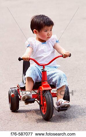 3 year old Chinese girl on tricycle. View Large Photo Image Stock Photo - 3 year old Chinese girl on tricycle.. Fotosearch
