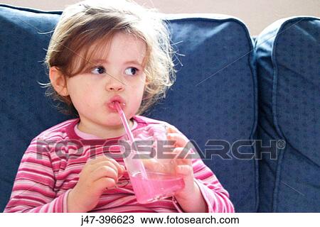 3 year old girl drinking juice through a straw, looking off camera View Large Photo Image Stock Image - 3 year old girl drinking juice through a straw, looking off camera. Fotosearch
