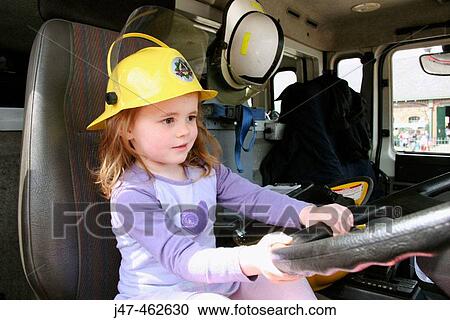 3 year old girl driving a fire engine wearing the hat View Large Photo Image Stock Image - 3 year old girl driving a fire engine wearing the hat. Fotosearch