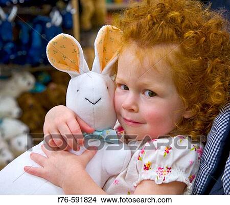 3 year old girl hugging stuffed bunny View Large Photo Image Picture - 3 year old girl hugging stuffed bunny. Fotosearch
