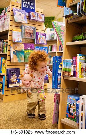 3 year old girl in bookstore View Large Photo Image Stock Photography - 3 year old girl in bookstore. Fotosearch