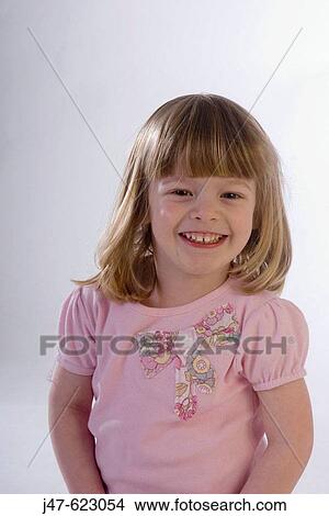 3 year old girl looking into camera, three quarter length, smiling and laughing View Large Photo Image Picture - 3 year old girl looking into camera, three quarter length, smiling and laughing. Fotosearch