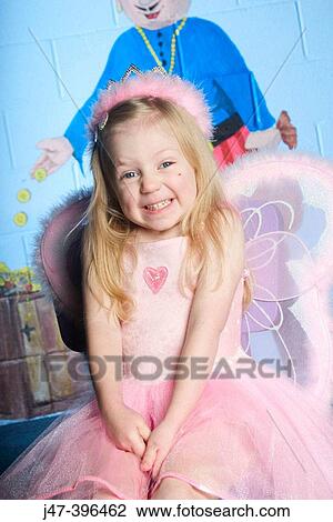 3 year old girl looking into camera, wearing a fairy outfit looking delighted and excited View Large Photo Image Stock Image - 3 year old girl looking into camera, wearing a fairy outfit looking delighted and excited. Fotosearch