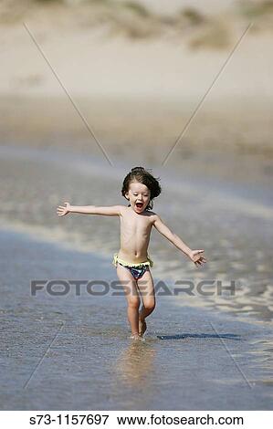 3 year old girl on beach View Large Photo Image Stock Photo - 3 year old girl on beach. Fotosearch