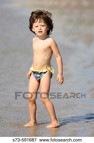 3 year old girl on the beach View Large Photo Image Stock Photo - 3 year old girl on the beach. Fotosearch