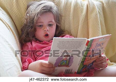 3 year old girl on the settee, with her knees up reading a bedtime story View Large Photo Image Stock Image - 3 year old girl on the settee, with her knees up reading a bedtime story. Fotosearch