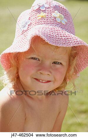 3 year old girl outside in the sunshine, wearing a pink hat smiling into camera View Large Photo Image Picture - 3 year old girl outside in the sunshine, wearing a pink hat smiling into camera. Fotosearch