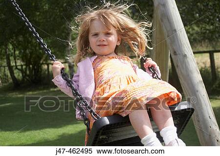 3 year old girl outside in the sunshine swinging on a swing View Large Photo Image Stock Photography - 3 year old girl outside in the sunshine swinging on a swing. Fotosearch