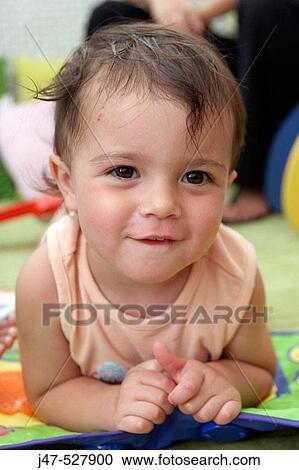 3 year old girl playing at nursery, smiling into camera View Large Photo Image Stock Image - 3 year old girl playing at nursery, smiling into camera. Fotosearch