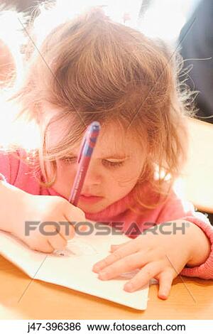 3 year old girl sitting at a table drawing View Large Photo Image Stock Photograph - 3 year old girl sitting at a table drawing. Fotosearch