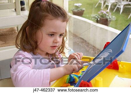 3 year old girl sitting drawing, with chalks View Large Photo Image Stock Photo - 3 year old girl sitting drawing, with chalks. Fotosearch