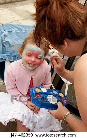 3 year old girl sitting smiling, having her face paintedwith her face painted View Large Photo Image Stock Photo - 3 year old girl sitting smiling, having her face paintedwith her face painted. Fotosearch