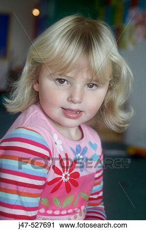 3 year old girl smiling into camera at nursery View Large Photo Image Stock Image - 3 year old girl smiling into camera at nursery. Fotosearch