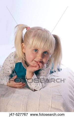3 year old, girl smiling into camera lying on her tummy View Large Photo Image Stock Photo - 3 year old, girl smiling into camera lying on her tummy. Fotosearch