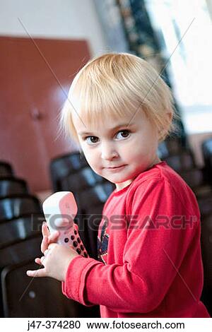 3 year old girl standing holding a telephone View Large Photo Image Stock Image - 3 year old girl standing holding a telephone. Fotosearch