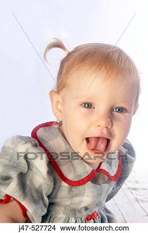 3 year old girl sticking her tounge out View Large Photo Image Picture - 3 year old girl sticking her tounge out. Fotosearch