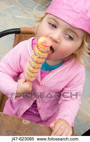 3 year old girl sucking a lolly View Large Photo Image Stock Photography - 3 year old girl sucking a lolly. Fotosearch