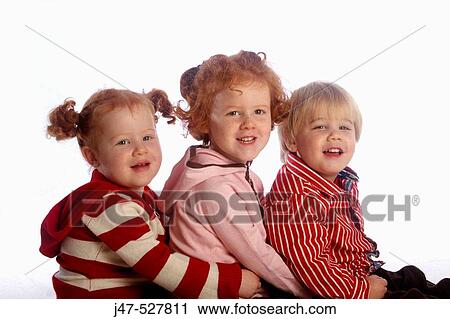 3 year old girl with red hair cuddling her brother, laughing and smiling into camera, in the studio View Large Photo Image Stock Image - 3 year old girl with red hair cuddling her brother, laughing and smiling into camera, in the studio. Fotosearch