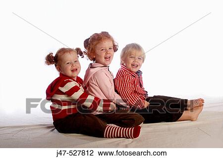 3 year old girl with red hair cuddling her twin brother and older sister, laughing and smiling into camera, in the studio View Large Photo Image Stock Image - 3 year old girl with red hair cuddling her twin brother and older sister, laughing and smiling into camera, in the studio. Fotosearch