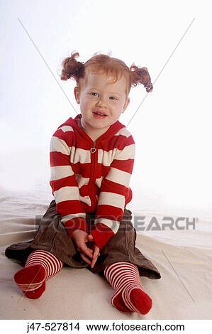 3 year old girl with red hair sitting in the studio smiling into camera, smiling into camera View Large Photo Image Picture - 3 year old girl with red hair sitting in the studio smiling into camera, smiling into camera. Fotosearch