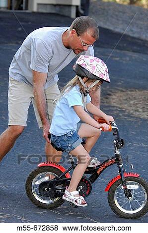 3 year old learning to ride a bike View Large Photo Image Stock Photo - 3 year old learning to ride a bike. Fotosearch