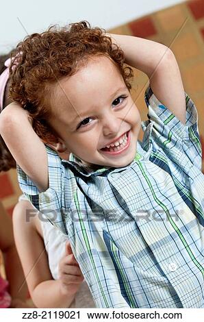 Stock Image - 3 years old boy with ginger hair smiling.. Fotosearch