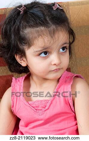 Stock Image - 3 years old girl looking away.. Fotosearch