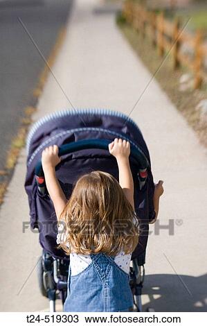 3 years old girl pushing her brother in stroller in neighborhood, Flagstaff, Arizona, USA View Large Photo Image Stock Image - 3 years old girl pushing her brother in stroller in neighborhood, Flagstaff, Arizona, USA. Fotosearch