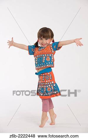 3 years old little girl dressed in a coustume from India standing on tiptoe. View Large Photo Image Stock Photo - 3 years old little girl dressed in a coustume from India standing on tiptoe.. Fotosearch