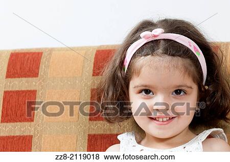 Stock Photo - 3 years old Middle eastern girl smiling.. Fotosearch