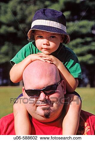 3 yr old boy sitting on fathers shoulders View Large Photo Image Stock Image - 3 yr old boy sitting on fathers shoulders. Fotosearch
