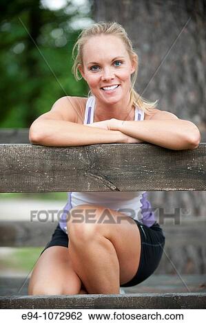 30 year old blonde woman in work out clothes smiling at camera View Large Photo Image Stock Image - 30 year old blonde woman in work out clothes smiling at camera. Fotosearch