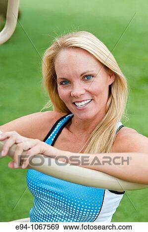 30 year old blonde woman in work out clothes exercising View Large Photo Image Stock Photo - 30 year old blonde woman in work out clothes exercising. Fotosearch