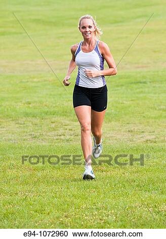 30 year old blonde woman jogging in work out clothes View Large Photo Image Stock Image - 30 year old blonde woman jogging in work out clothes. Fotosearch