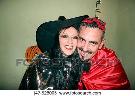 30 year old couple dressed up in Halloween fancy dress View Large Photo Image Stock Photography - 30 year old couple dressed up in Halloween fancy dress. Fotosearch